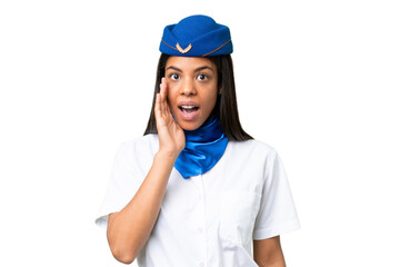 Airplane stewardess African american woman over isolated background with surprise and shocked facial expression