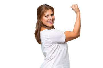 Middle-aged caucasian woman over isolated background doing strong gesture