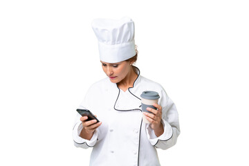 Middle-aged chef woman over isolated background holding coffee to take away and a mobile