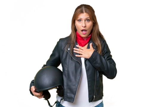 Middle-aged caucasian woman with a motorcycle helmet over isolated background surprised and shocked while looking right