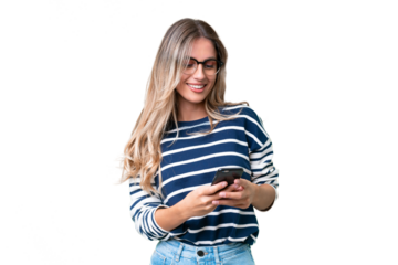 Young Uruguayan woman over isolated background sending a message with the mobile