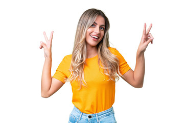 Young Uruguayan woman over isolated background showing victory sign with both hands