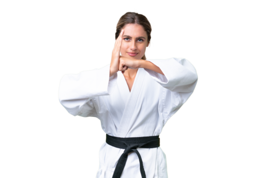 Young Uruguayan woman over isolated background doing karate and saluting - Powered by Adobe