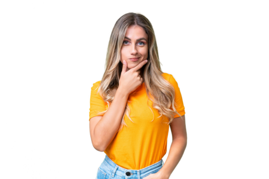 Young Uruguayan woman over isolated background thinking