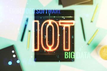 Double exposure of creative IOT hologram and digital tablet on background, top view, research and development concept