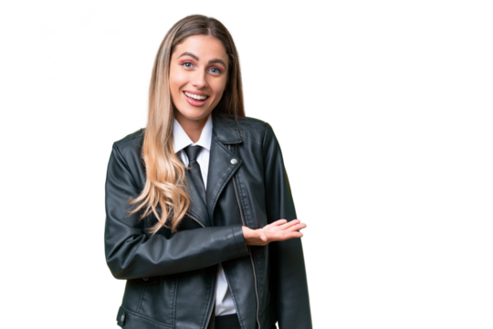 Business pretty Uruguayan woman wearing a biker jacket over isolated background presenting an idea while looking smiling towards