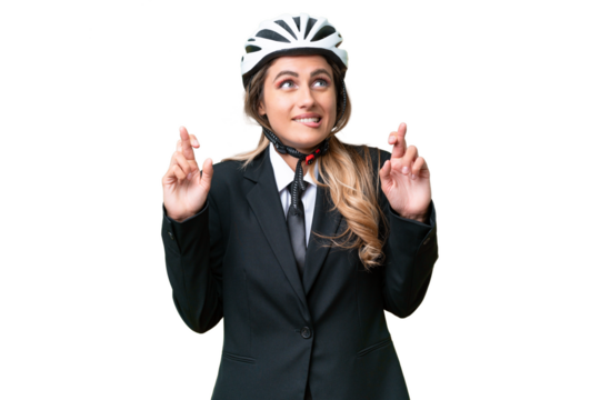 Business Uruguayan woman wearing a helmet biker over isolated background with fingers crossing