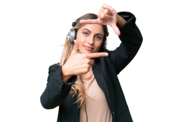 Telemarketer pretty Uruguayan woman working with a headset over isolated background focusing face. Framing symbol