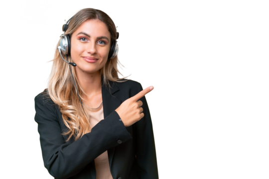 Telemarketer pretty Uruguayan woman working with a headset over isolated background pointing to the side to present a product