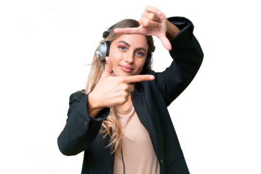 Telemarketer pretty Uruguayan woman working with a headset over isolated background focusing face. Framing symbol