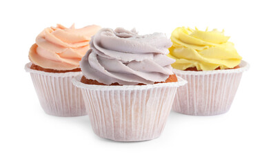 Tasty cupcakes with cream isolated on white