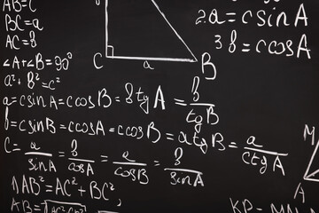 Fototapeta na wymiar Different mathematical formulas written with chalk on blackboard