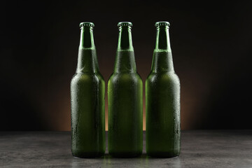 Many bottles of beer on grey table