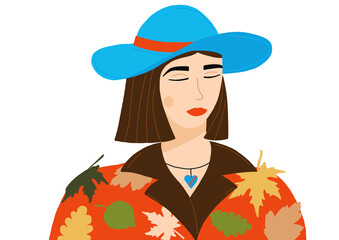 Female portrait. Girl in autumn leaves and a blue hat. Autumn leaf fall.