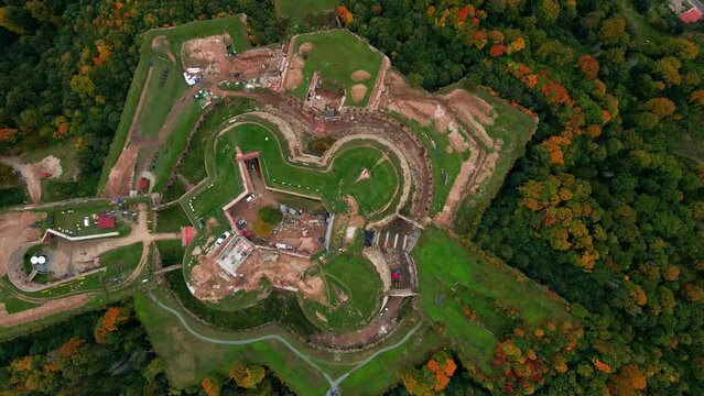 Srebrna Gora fortress and Sudety mountains at autumn season, aerial drone view. Military fort landmark for tourists in Lower Silesia, Poland