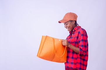 beautiful lady isolated over white background looking into her hopping bag