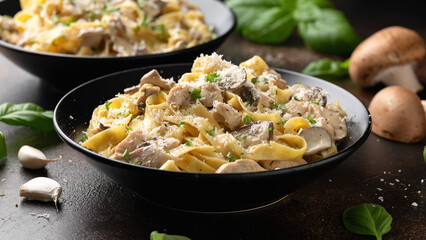 Creamy Alfredo pasta with chicken, mushrooms and parmesan cheese. Healthy Italian food