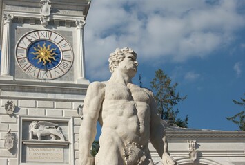 A view of Piazza Libertà in Udine, North Italy. Details of the clock tower and Hercules statue