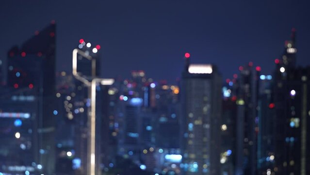Blur film grain background of Abstract bokeh lights. horizontal with skyscrapers night lights. horizontal 4k height resolutions 2160 x 384