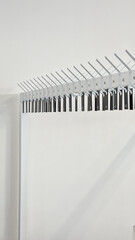 Wardrobe. Row of empty hangers with numbers. Theatrical wardrobe. Stylish minimalist wardrobe