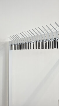Wardrobe. Row of empty hangers with numbers. Theatrical wardrobe. Stylish minimalist wardrobe