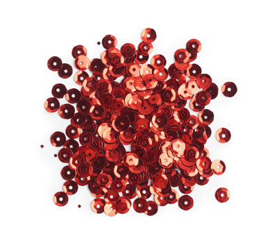 Pile of red sequins isolated on white, top view