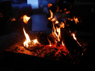 Close up flame, warm beautiful fireplace orange color in the room, winter time, freeze outside, copy space