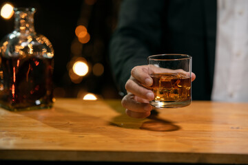 Barman pouring whiskey whiskey glass beautiful night