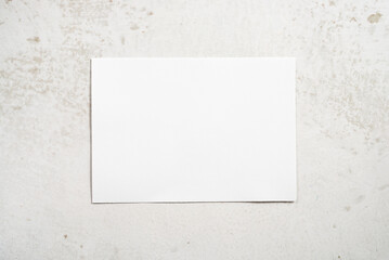 white rectangle paper on marble background 