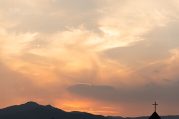 Sunset over the mountains. clouds in the sky