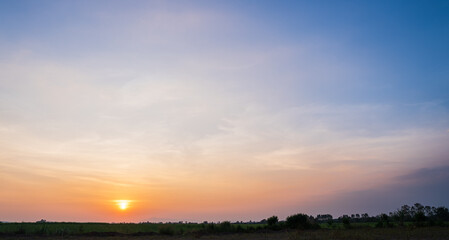 sunset sky in the evening over the field