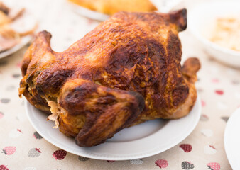 whole roasted chicken on a plate