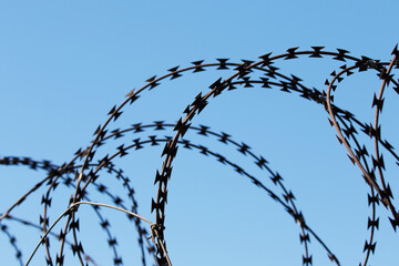 Steel razor wire for protecting a private area