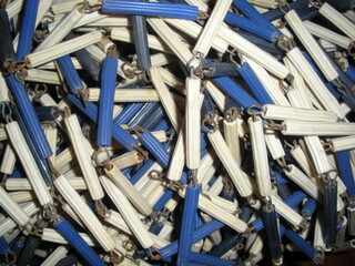old cylindrical blue and white clay beads