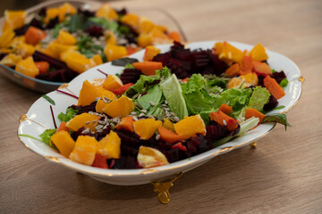 Cooking grilled salad of beetroot, pumpkin, orange, cream cheese.