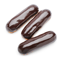 Tasty eclairs in chocolate glaze on white background