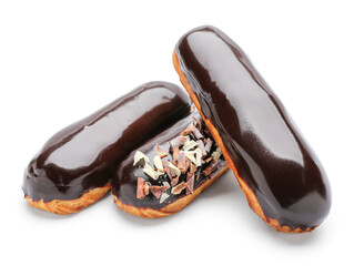 Delicious eclairs in chocolate glaze on white background