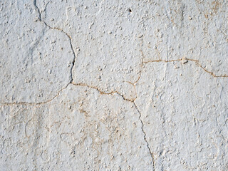 Abstract grunge texture of a rough old wall with cracks on it