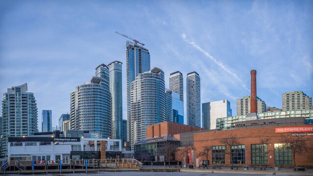TORONTO, CANADA - MARCH 26, 2018:  Toronto Harbourfront Centre, the Power Plant and a cluster of nearby modern high rise buildings