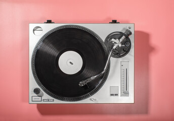 vinyl turntable playback music record isolated on pink background