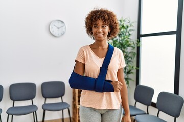 Young african american woman smiling confident injury at clinic waiting room