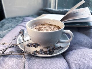 Cup of coffee and lavender flowers