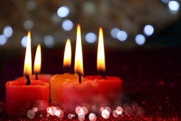 Lit Tea Light Candles' and bokeh/Christmas Decoration