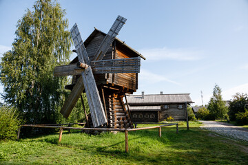 Reconstructed ancient wooden windmill on the banks of the Svir River in the craft and museum...