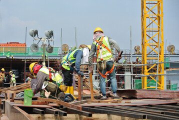 SERDANG, MALAYSIA -MAY 13, 2016: Construction workers working at the construction site at Serdang,...