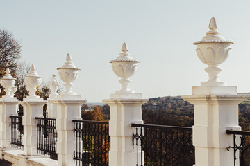 White stone fence balustrade in autumn park