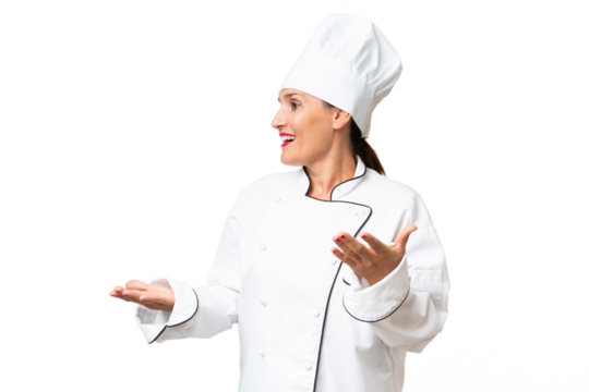 Middle-aged chef woman over isolated background with surprise facial expression