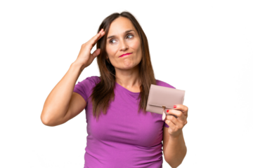 Middle-aged caucasian woman holding a wallet over isolated background having doubts and with confuse face expression