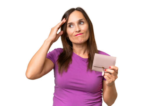 Middle-aged caucasian woman holding a wallet over isolated background having doubts and with confuse face expression