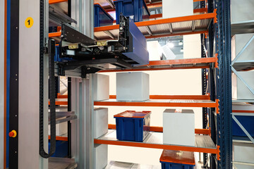 Warehouse robot. Automated equipment moves boxes on racks. Warehouse automatic robot. Modern warehouse technologies. Distribution center automation equipment. Forklift robot for picking up boxes